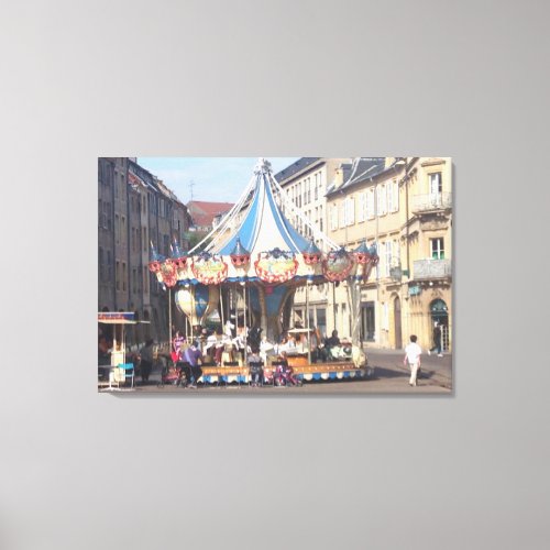 Fair Ground Roundabout in an Ancient French Town Canvas Print