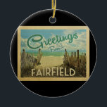 Fairfield Beach Vintage Travel Ceramic Ornament<br><div class="desc">This Greetings From Fairfield vintage postcard design features a sandy beach with a beautiful turquoise ocean water and above the sea,  a blue sky with billowy white clouds. In vintage travels style.</div>