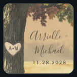 Fall Carved Oak Tree Country Rustic Wedding Favor Square Sticker<br><div class="desc">Design features a unique oak tree with fall leaves in shades or red,  burgundy,  green,  yellow,  orange and more. The background features a country rustic wheat field setting. Carve the initials of your choice into the carved heart on the tree.</div>