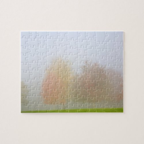 Fall trees shrouded in mist jigsaw puzzle
