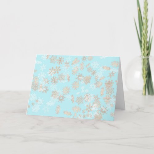 Falling snowflakes pattern on blue background card