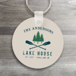 Family Lake House Modern Rustic Boat Oar Pine Tree Keychain<br><div class="desc">A beautiful modern rustic themed round keychain, featuring your family name and lake house, cabin, cottage or other desired text and its established date, all in rustic style typography. This unique, custom design features teal blue boat oars, paddles and pine trees in soft green. The designs cream base color is...</div>