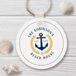 Family Name Beach House Anchor Gold Laurel Star Keychain<br><div class="desc">A stylish nautical style metal keychain with your personalized family name and beach house, lake house, or other desired text and established date. Features a custom designed boat anchor with gold style laurel leaves and a star on white or easily customize the base color to match your current decor or...</div>