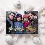 Family name two photo red Christmas Foil Holiday Card<br><div class="desc">Your family name or custom message in chic gold foil will make your holiday card stand out. This unique design features a signature script in foil on a single photo with room below for names, year or any custom message. The back is a festive holiday red speckled with a white...</div>