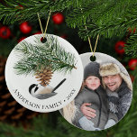 Family Photo Chickadee on Pine Sprig Christmas Ceramic Ornament<br><div class="desc">This special family photo keepsake Christmas ornament features a cute little chickadee is perched on a pine cone on the front, with the family name and year, and a photo on the back. Easily customize the templates with your own text and photo. *If you need design assistance or matching products,...</div>