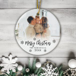 Family Photo Merry Christmas Script Snowflakes  Ceramic Ornament<br><div class="desc">Elegant Modern Black White Hand Lettered Script "Merry Christmas" Family Photo Ornament. Features a family photo, a Merry Christmas text which is written in handwritten calligraphy script, snowflakes and year on photo overlay (in black and white). Easy to personalize it. Photo tip: crop your photo to square form before upload...</div>