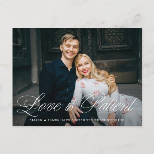 Fancy Script Love is Patient Wedding Postponement Announcement Postcard