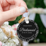 Fancy Silver on Black Bridesmaid Wedding Keychain<br><div class="desc">These beautiful bridesmaid keychains are designed to be given as a gift or wedding favor. The design is simple yet elegant and features a frilly silver gray border with pale gray text on a black background. There is space for her name, the wedding date and the names of the couple....</div>