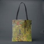 Farm Garden with Crucifix by Gustav Klimt Tote Bag<br><div class="desc">Farm Garden with Crucifix (1911/1912) by Gustav Klimt is a vintage Victorian Era Symbolism fine art religious painting. A nature scene with a variety of flowers surrounding a crucifix with Jesus Christ in a garden on a farm. About the artist: Gustav Klimt (1862-1918) was an Austrian Symbolist painter and one...</div>