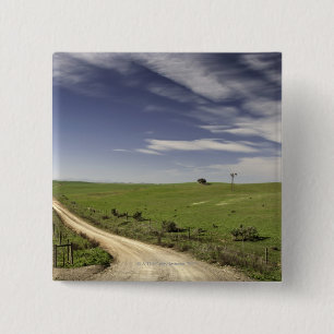 Farm road twining between wheat fields, Caledon, Pinback Button
