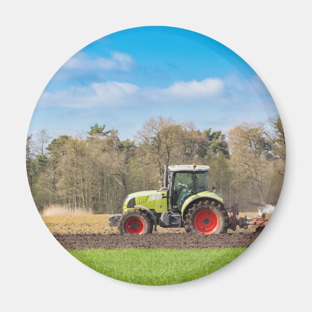 Farmer on tractor plowing sandy soil in spring magnet (Front)