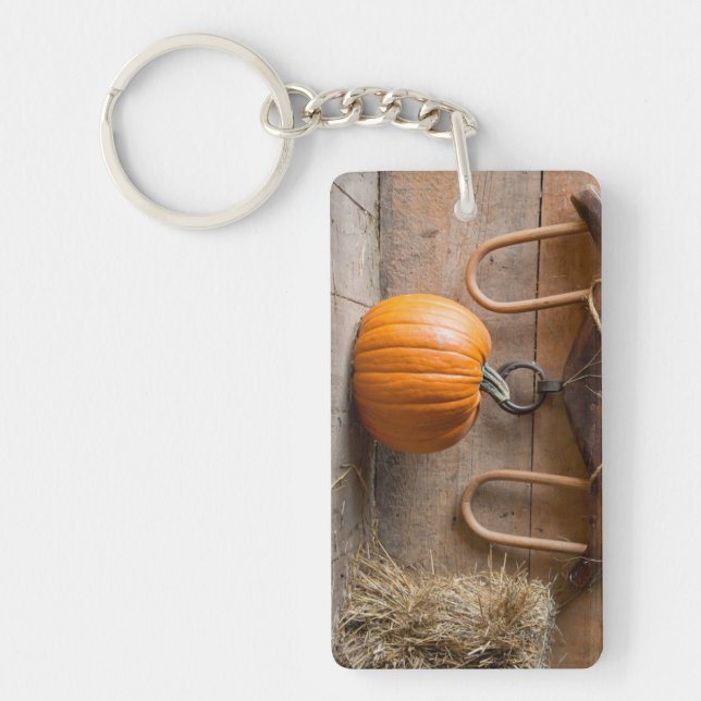 Farmers Museum. Pumpkin in barn with bale of hay Keychain (Front)