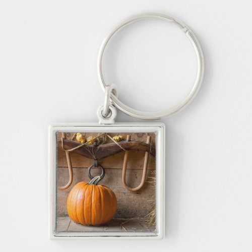 Farmers Museum Pumpkin in barn with bale of hay Keychain