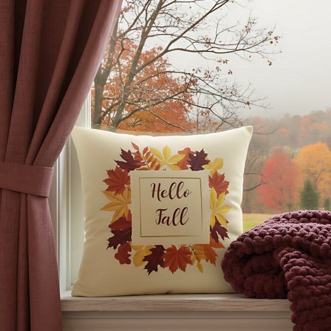 Farmhouse Hello Fall Accent with Rustic Leaves Throw Pillow ("Hello Fall” pillow with autumn leaf wreath decorates a window with colorful fall view.)