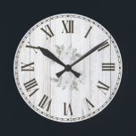 Farmhouse White Wood Greenery Botanical Round Clock<br><div class="desc">Farmhouse White Wood Greenery Botanical Round Clock - Keep time in calming style with this farmhouse wall clock featuring soft green botanical accents on distressed white woodgrain. Ideal for kitchens,  entryways,  or living rooms,  it adds a fresh,  natural touch to any rustic or cottage-inspired space.</div>