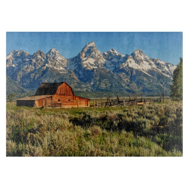 Farms | Barn Shadowed by Snow Capped Mountains Cutting Board (Front)