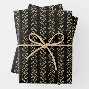Faux gold and black pattern wrapping paper sheets