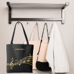 Faux gold music notes on a chic black backdrop tote bag<br><div class="desc">Simple and elegant for a music lover! Black background with faux gold music notes. Template for your name,  golden hand lettered style script.</div>