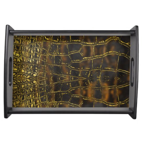 Faux gold snake skin texture on dark marble serving tray