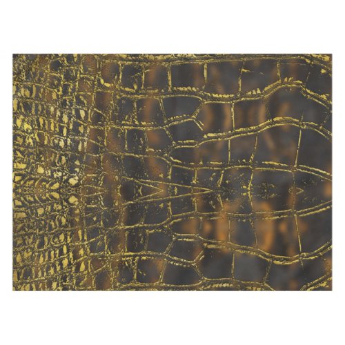 Faux gold snake skin texture on dark marble tablecloth