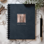 Faux Leather Navy Blue Rose Gold Monogram 2025 Planner<br><div class="desc">This elegant planner features a digital background image in imitation of navy blue leather texture. Personalize it with your monogram initial in navy blue decorative font and your name in navy blue copperplate lettering on a rose gold faux brushed metal square, along with the year or other text of your...</div>