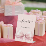 Favor sign pink bow<br><div class="desc">Pink background,  decorated with a large bow.  Text: Favors. Please take one!</div>