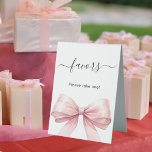 Favor sign pink bow white<br><div class="desc">White elegant background,  decorated with a large pink bow.  Text: Favors. Please take one!</div>