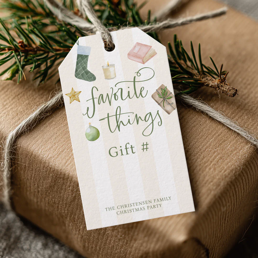 A cream striped gift tag with green script and watercolor illustrations of a stocking, candle, book, star, ornament, and wrapped parcel, tied with twine to a kraft paper gift topped with pine sprigs.
