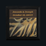 Feathers Layered Brown Gold Wedding Keepsake Gift Box<br><div class="desc">This beautiful wedding keepsake gift box features a photo of elegant duck feathers.  The beautiful brown and gold feathers form long ovals that overlap revealing wispy feathering.  Quickly and easily personalize the bride and groom's names and wedding date which appears against a solid dark brown banner.</div>