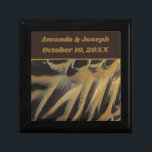 Feathers Layered Brown Gold Wedding Keepsake Gift Box<br><div class="desc">This beautiful wedding keepsake gift box features a photo of elegant duck feathers.  The beautiful brown and gold feathers form long ovals that overlap revealing wispy feathering.  Quickly and easily personalize the bride and groom's names and wedding date which appears against a solid dark brown banner.</div>