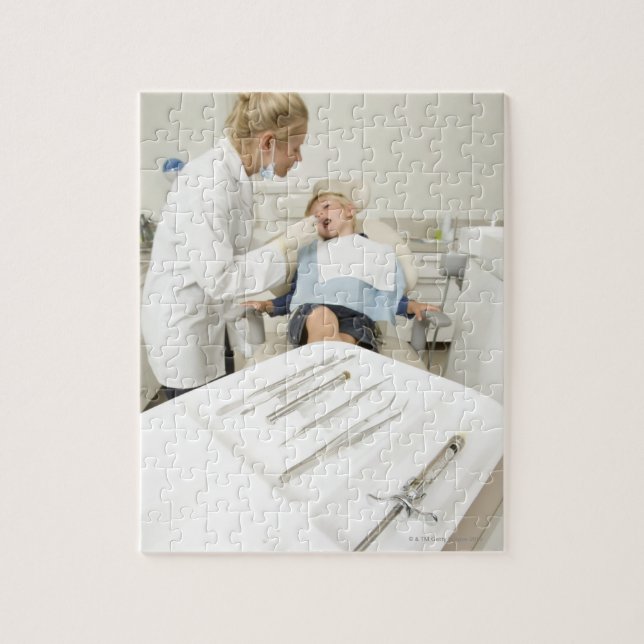 Female dentist examining little boy jigsaw puzzle (Vertical)