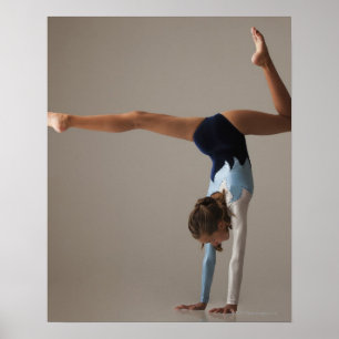 Female gymnast (12-13) performing handstand poster