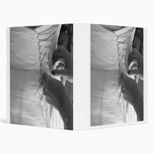 Female hand lacing up wedding dress back binder