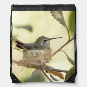 Female hummingbird on her nest drawstring bag