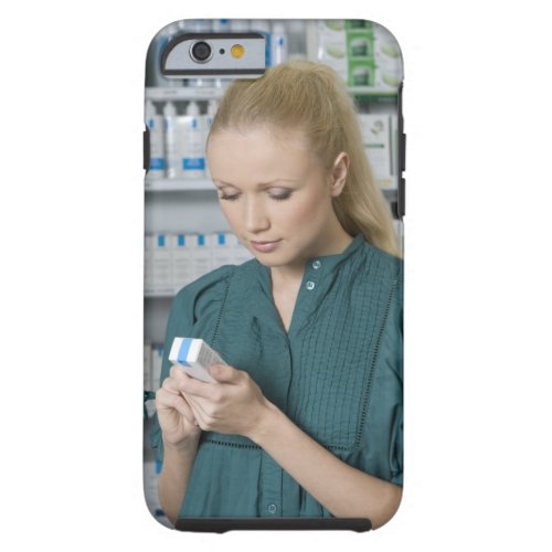 Female pharmacist looking at medicine in 2 tough iPhone 6 case