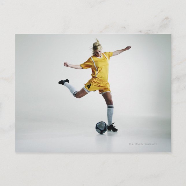 Female soccer player preparing to kick soccer postcard (Front)
