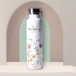 Feminine Boho Botanical Wildflowers with Monogram Water Bottle<br><div class="desc">Contemporary with a fresh feminine look, this lovely water bottle is bordered along the bottom in watercolor wildflowers with beautiful soft pastel colors of yellow, pink, blue and ivory beige. A text template is included to personalize with a first name and monogram initial of the last name. This high quality...</div>