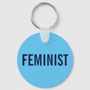 Feminist, bold navy text on sky blue keychain