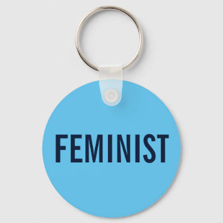 Feminist, bold navy text on sky blue keychain