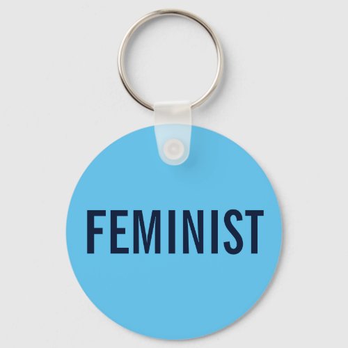 Feminist bold navy text on sky blue keychain