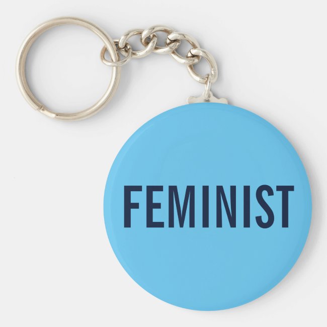 Feminist, bold navy text on sky blue keychain