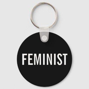 Feminist, bold white text on black keychain