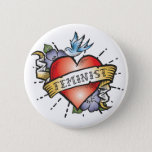 Feminist Pinback Button<br><div class="desc">Feminist Button - This ultra cool pinback button features a realistic tattoo heart with a vintage style banner and the word Feminist. An awesome gift idea for young women finding their way. Style up,  seize the day and show who's in charge with this very cool feminist button.</div>
