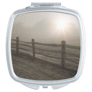 Fence and Sunburst Through Fog near Sharon Compact Mirror