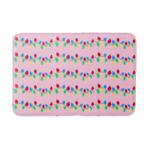 Festive Christmas String Lights on Pink Bath Mat