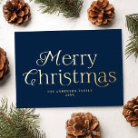Festive Elegance Navy Merry Christmas Non-Photo Foil Holiday Card<br><div class="desc">Simple holiday card featuring "Merry Christmas" displayed in elegant gold foil lettering with a navy background. Personalize the front of the non-photo Christmas card with your family name and the year. The card reverses to display your personal message in white lettering surrounded by subtle white dots on a navy background....</div>