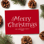 Festive Elegance Red Merry Christmas Non-Photo Holiday Card<br><div class="desc">Simple holiday card featuring "Merry Christmas" displayed in elegant white lettering with a red background. Personalize the front of the non-photo Christmas card with your family name and the year. The card reverses to display your personal message in white lettering surrounded by subtle white dots on a red background.</div>