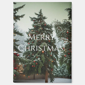 Festive fir trees decorated with garlands magnet
