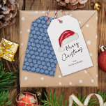 Festive Minimal Santa Hat Cute Whimsical Christmas Gift Tags<br><div class="desc">This minimal "Merry Christmas" gift tag features a hand drawn Santa hat on the front and fun light blue poinsettias on a traditional dark blue background on the back that add a touch of nostalgic whimsy. Original art by Malissa Melrose.</div>