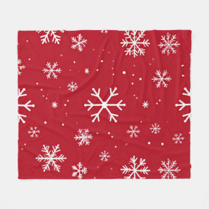 Festive red background with white snowflakes fleece blanket